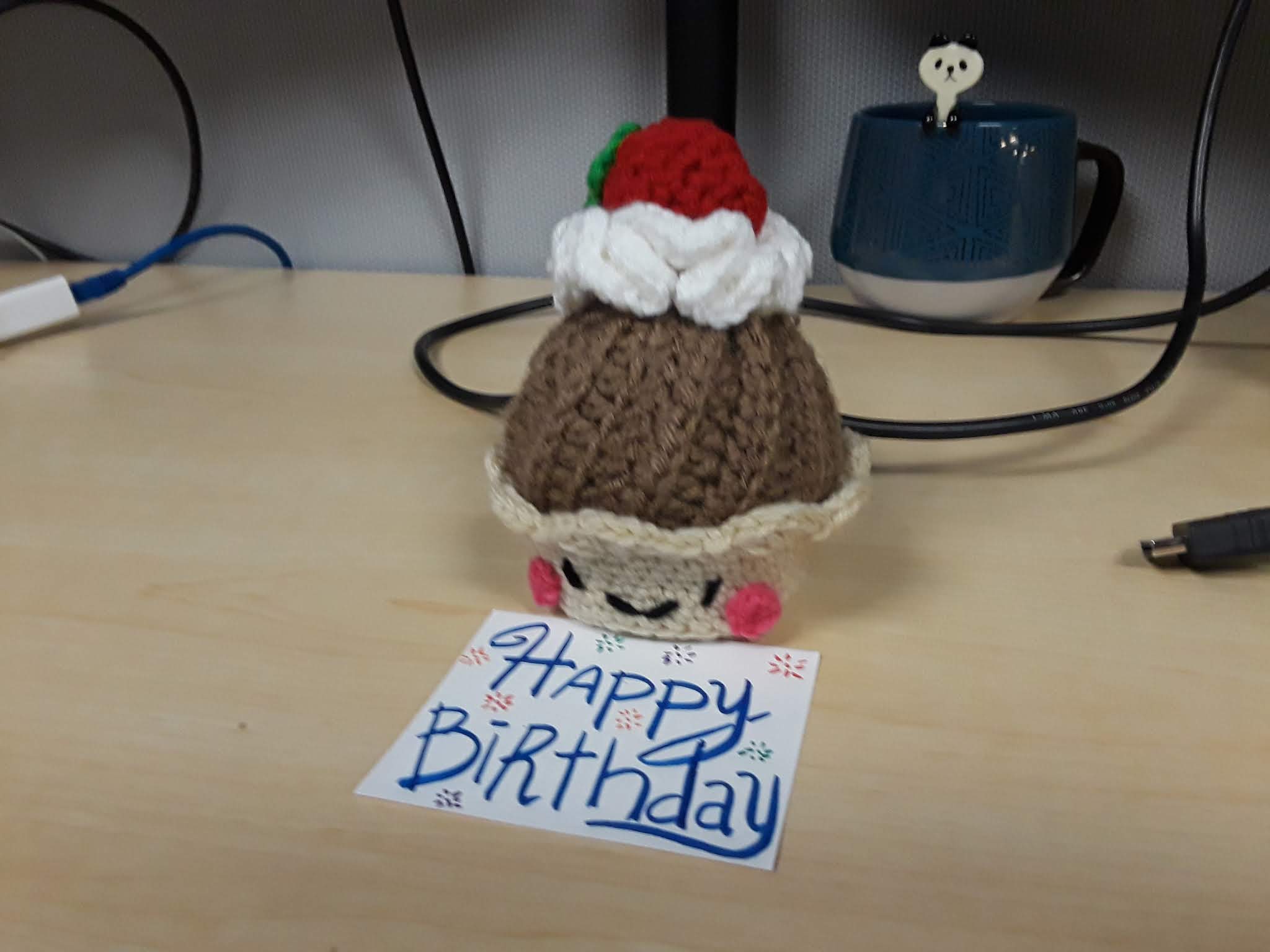 Picture of a small crochet cupcake doll.